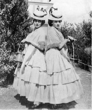 Olivia and Joan Fontaine in dress-up as teenagers, in Saratoga, California