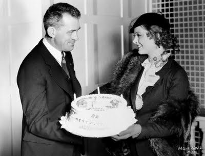 Birthday party on the set of Penthouse: Myrna with the director who made her a star, W.S. Van Dyke