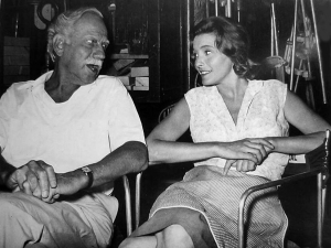 Melvyn Douglas chatting with co-star Patricia Neal on the set  during a break while filming Hud in 1963; Both earned Oscars for it